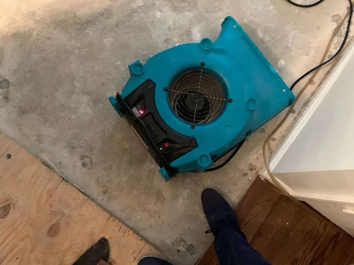 Air mover drying subfloor during Leak Detection & Repair in Monroeville